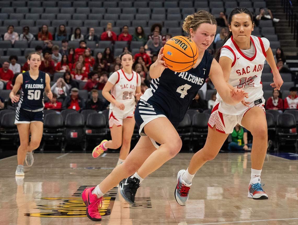 The Forest Lake Christian Falcons’ Bree Wilson drives to the basket against Sacramento Adventist Capitals guard Liann Wagner in the CIF Sac-Joaquin Section Division VI girls basketball championship on Friday at Golden 1 Center. Forest Lake Christian on Wednesday defeated St. Vincent de Paul to advance to the CIF NorCal Regional Division VI semifinal round.