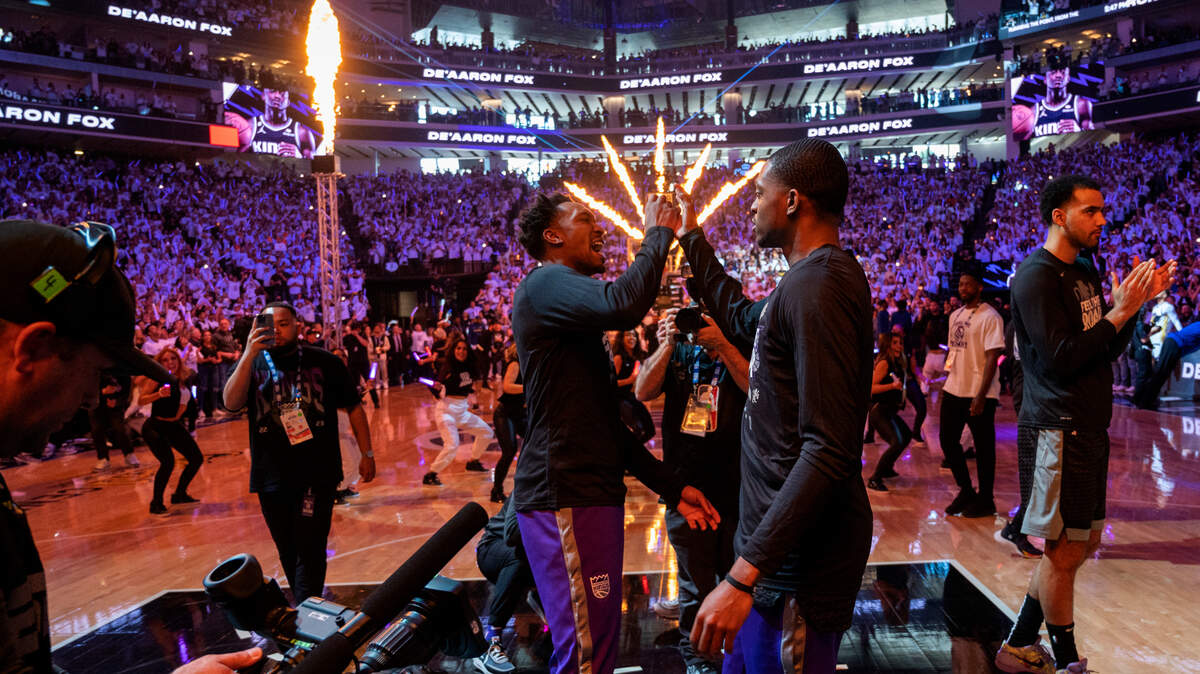 Sacramento Kings guard Malik Monk (0) and Sacramento Kings guard De’Aaron Fox (5) high-five during Game 1 of the first-round NBA playoff series at Golden 1 Center on Saturday, April 15, 2023.