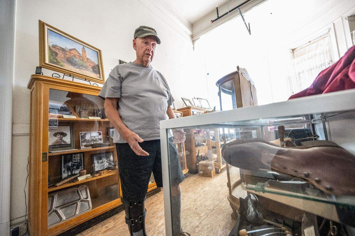 Karl Knobelauch, president of the nonprofit Preston Castle Foundation, on Aug. 28 shows leather shoes made by wards at the facility in Ione. According to Knobelauch the shoes were cut in half so they couldn’t be removed from the facility when the ward completed his sentence.