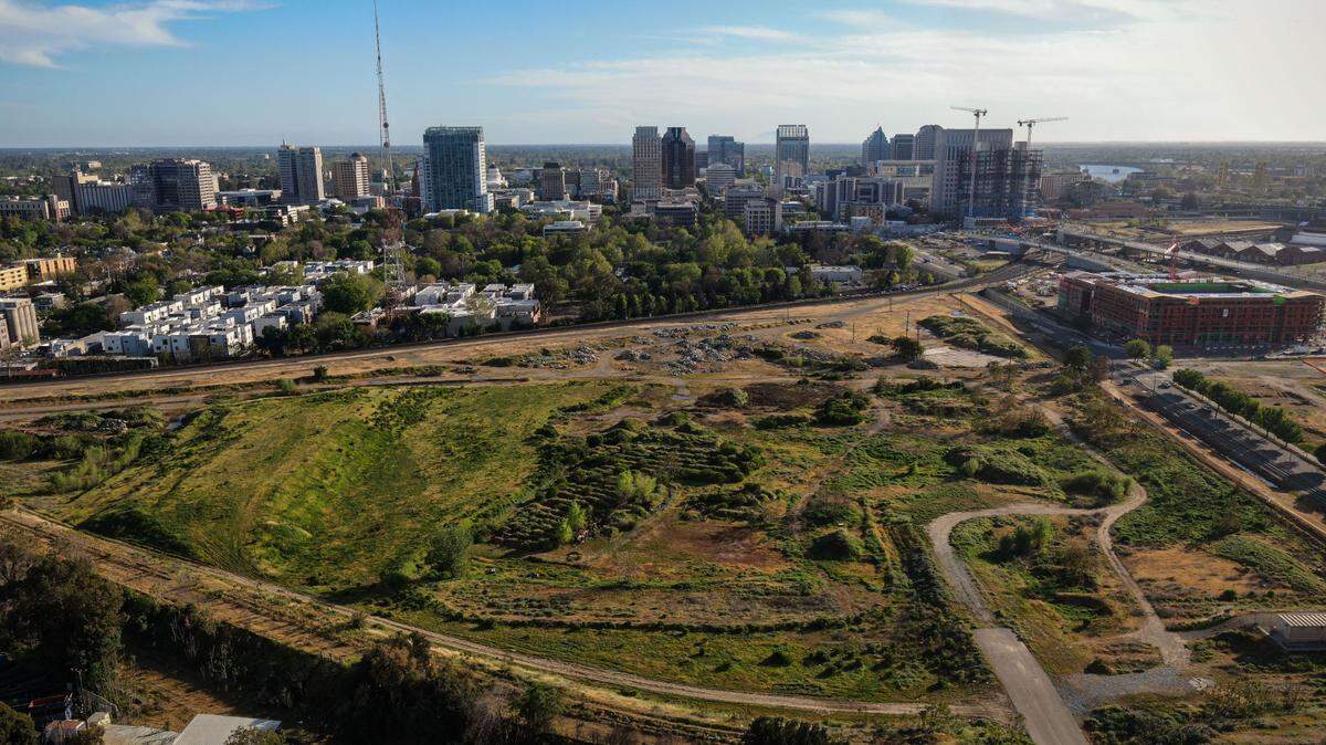 The site of Sacramento Republic FC’s new proposed stadium — previously planned for a new MLS soccer franchise that did not materialize — is seen in a drone photo south of B Street on Tuesday, March 29, 2022, outside downtown Sacramento.