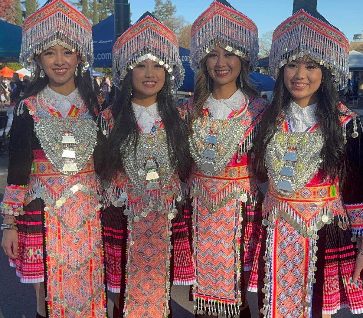 Sisters Darling, Alisha, Mina and Betsy Yang came from Stockton to Sacramento’s Cal Expo with their mom, cousin and friend to celebrate their culture at the Hmong New Year festival on Friday. They wore coordinated outfits that their mother had purchased for them.