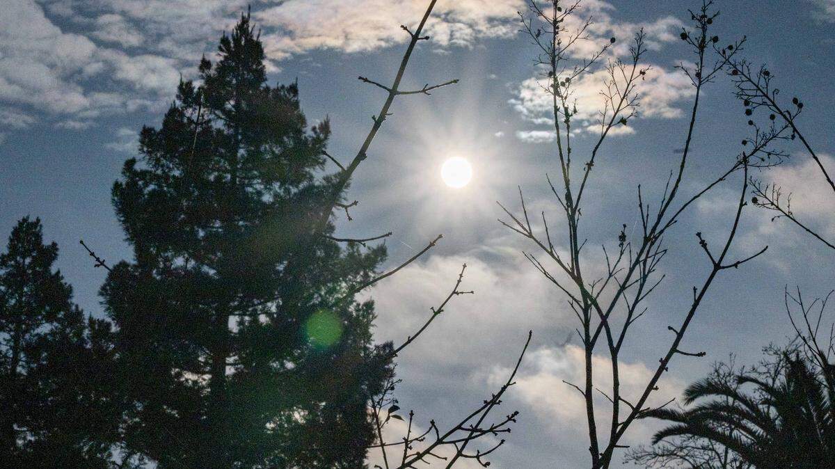 The sun briefly appears amid partial cloud cover over Sacramento on Tuesday, Dec. 16, 2025.