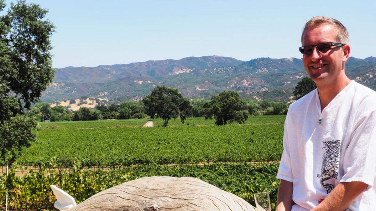 Jason McConnell, winemaker at Rivino Estate Vineyards and Winery, which he owns with his wife Suzanne Jahnke-McConnell, flanked by the estate’s vineyards stretching to the Russian River.