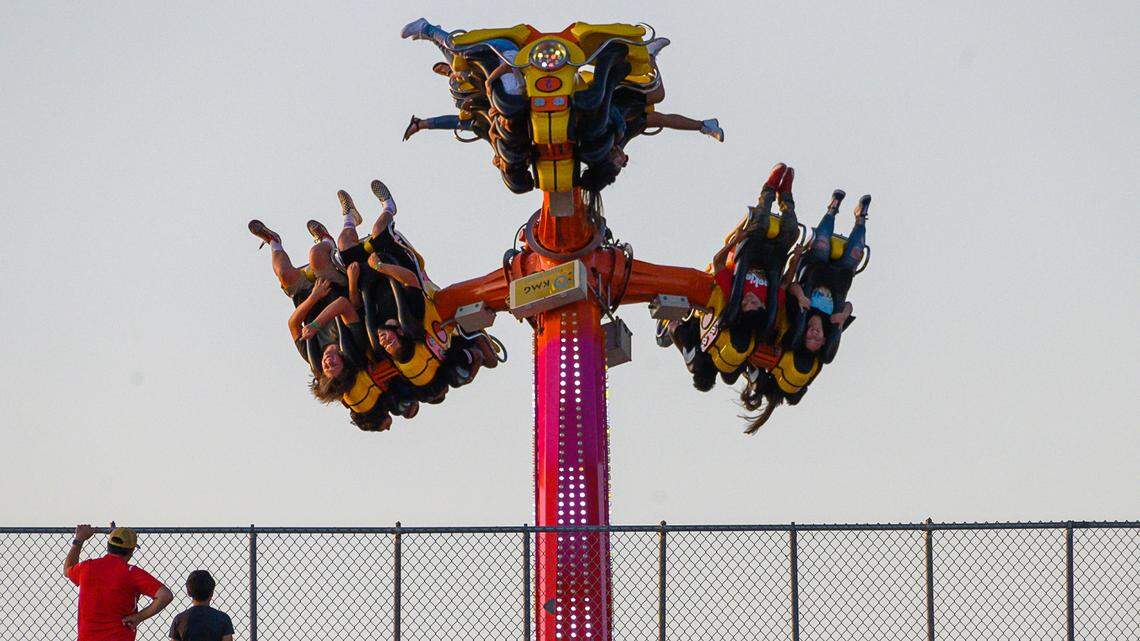 Soccer fans attending a Republic FC game in 2019 have a birds-eye view from the top of the stadium of people on the Turbo That ride at the State Fair at Cal Expo.