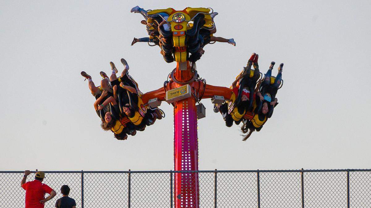 Soccer fans attending a Republic FC game in 2019 have a birds-eye view from the top of the stadium of people on the Turbo That ride at the State Fair at Cal Expo.