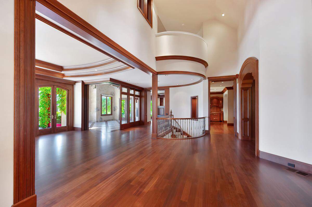 Cherry wood flooring gives a warm feeling to the main living areas of the Serrano community estate.