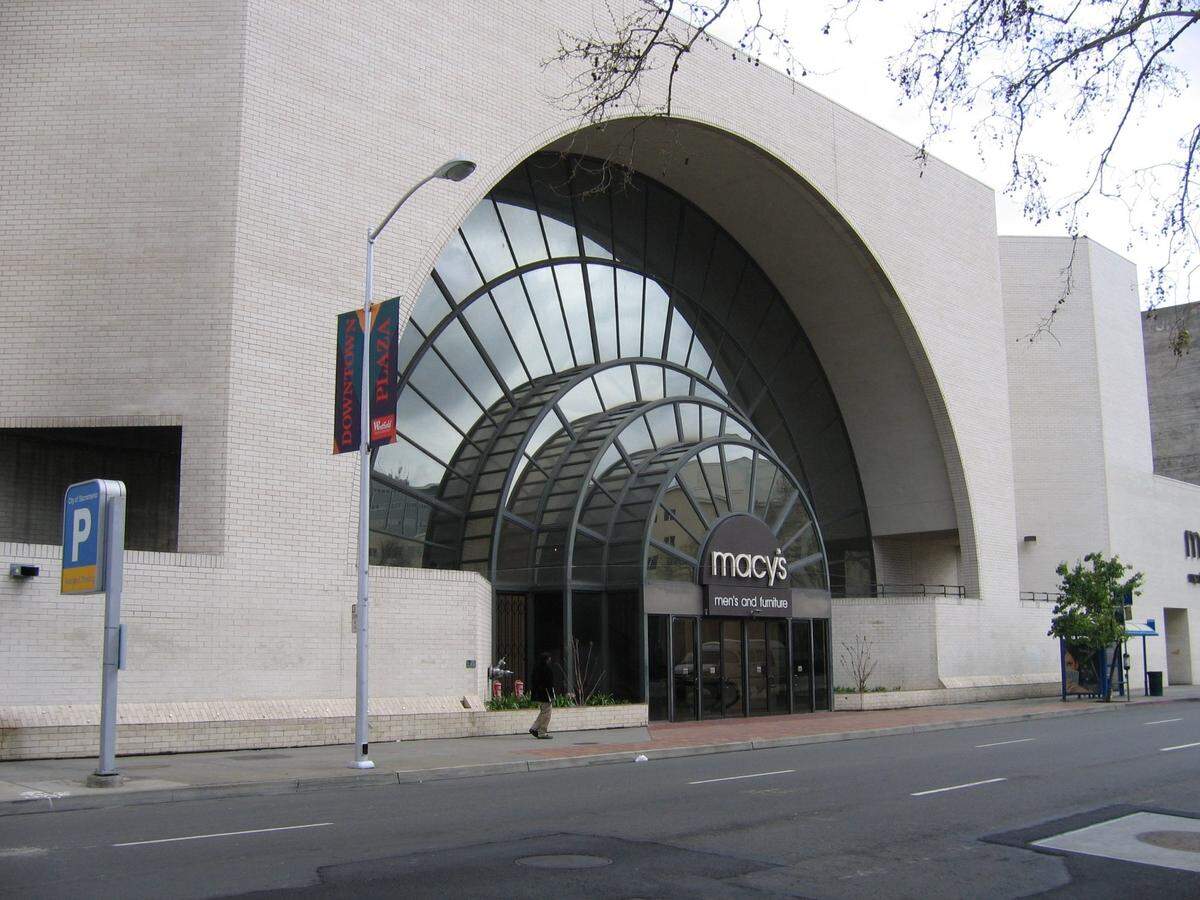 For a time, Macy’s operated two full-size department stores in Downtown Plaza, taking over in 1996 the former Weinstock’s building with its distinctive L Street entrance and selling men’s clothes and furniture down the street from the main location. The retailer operated more than 500,000 square feet at Downtown Plaza between the two stores. The building, shown in 2006, was demolished to make way for Golden 1 Center after the city used eminent domain to wrest control of the then-vacant property from a group of mortgage-certificate holders and CalPERS.