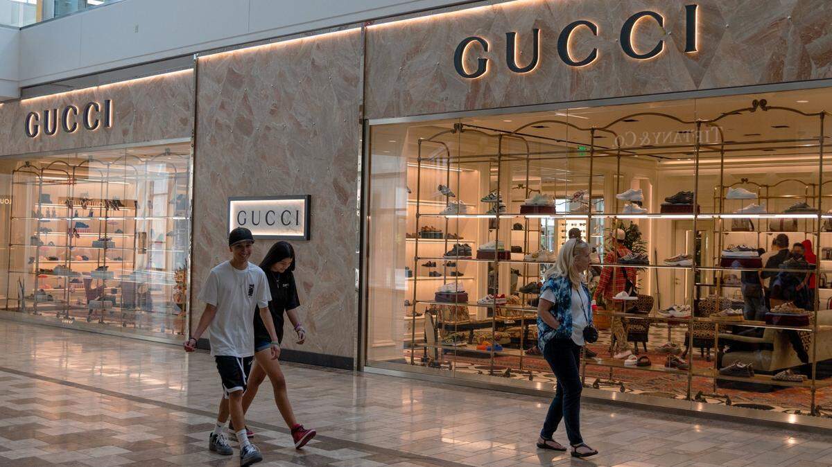 Shoppers browse for items in the Gucci Store at the Westfield Galleria at Roseville on Friday.. The store opened in April.