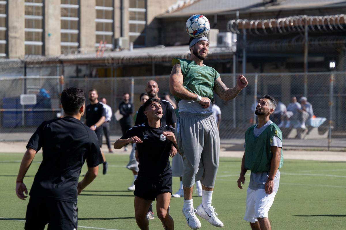 Folsom State Prison inmate Jamie Lopez heads the ball during a scrimmage against the Sacramento Republic FC players Tuesday.