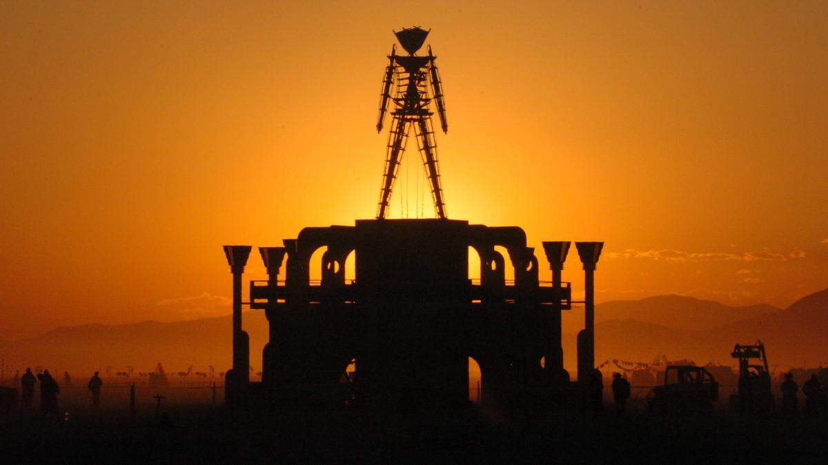 “The Man,” a symbol of the Burning Man art festival, is silhouetted against a morning sunrise in this photo from Sept. 2, 2006.