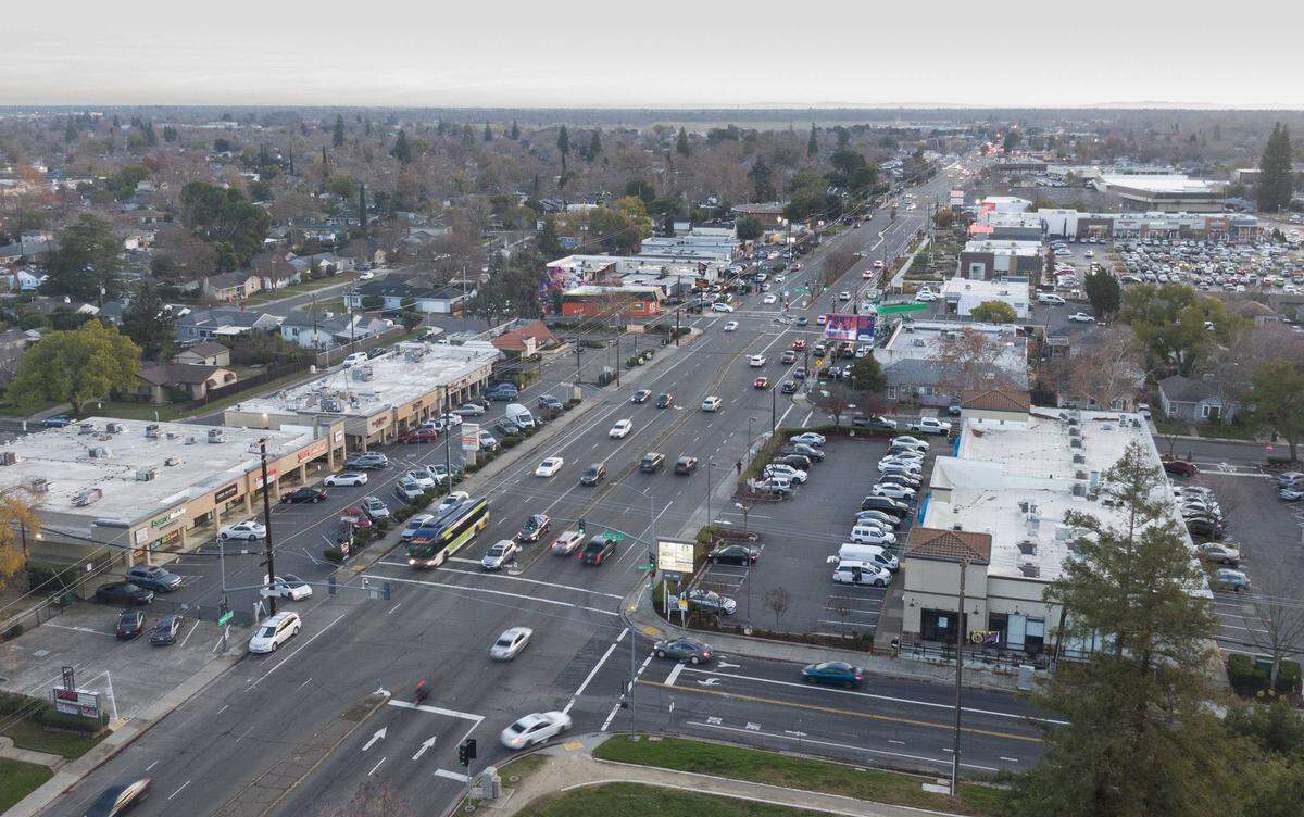 A Regional Transit bus drives north on Freeport Boulevard near William Land Park in Sacramento on Dec. 17, 2024. Sacramento officials have sought state Active Transportation Program funding to redesign the corridor, where repeated pedestrian crashes have underscored the need for safety improvements.