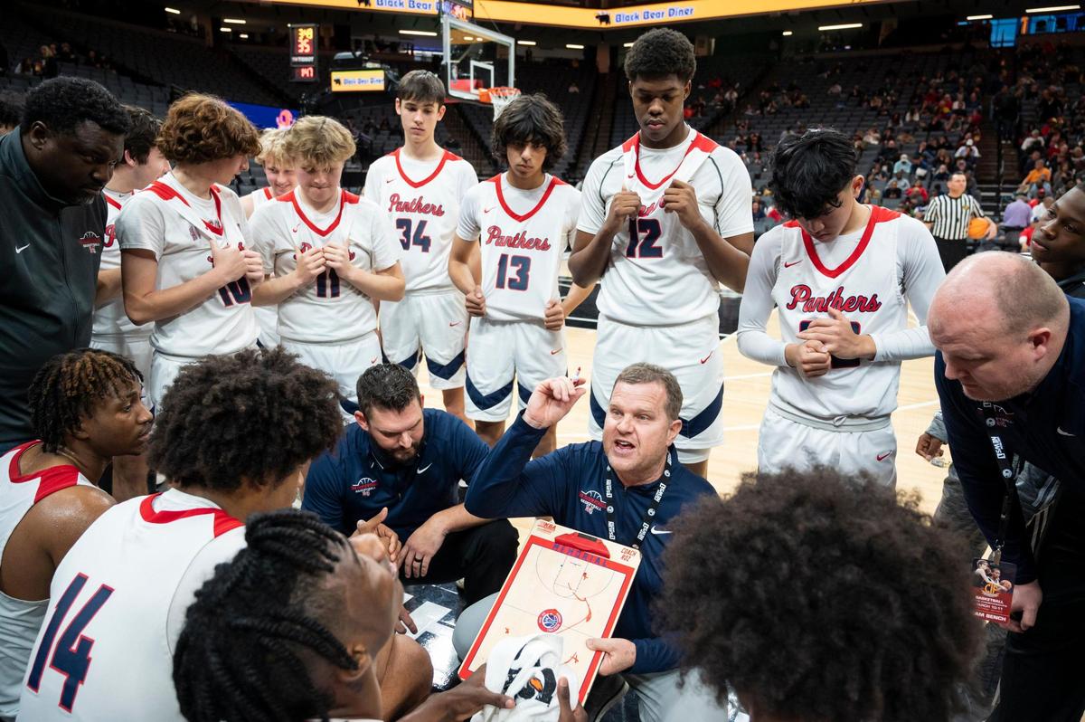 San Joaquin Memorial Panthers coach Brad Roznovsky talks with the team during a timeout in the last four minutes of the CIF State Division II Boys Basketball Championship on Saturday, March 11, 2023, at Golden 1 Center in Sacramento. The Panthers defeated the Tritons 58-47.