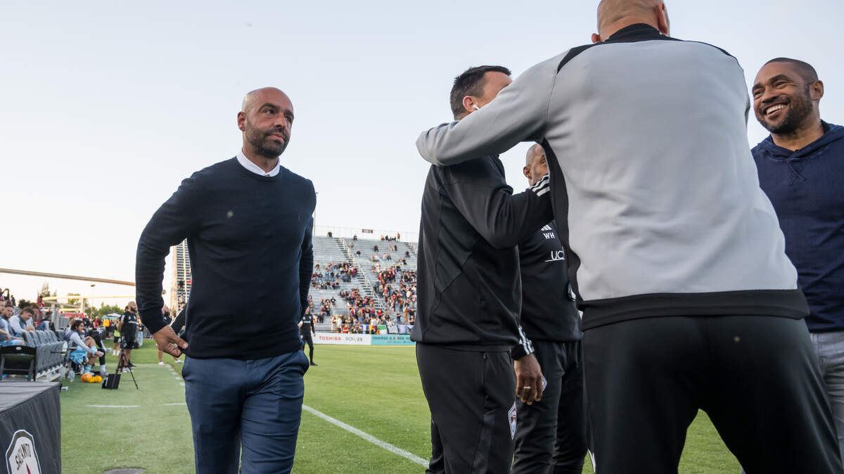 Sacramento Republic FC head coach Mark Briggs, left, walks back to his bench after greeting Colorado Rapids head coach Robin Fraser, right, before their U.S. Open Cup Round of 32 soccer match Tuesday, May 9, 2023, at Heart Health Park in Sacramento.