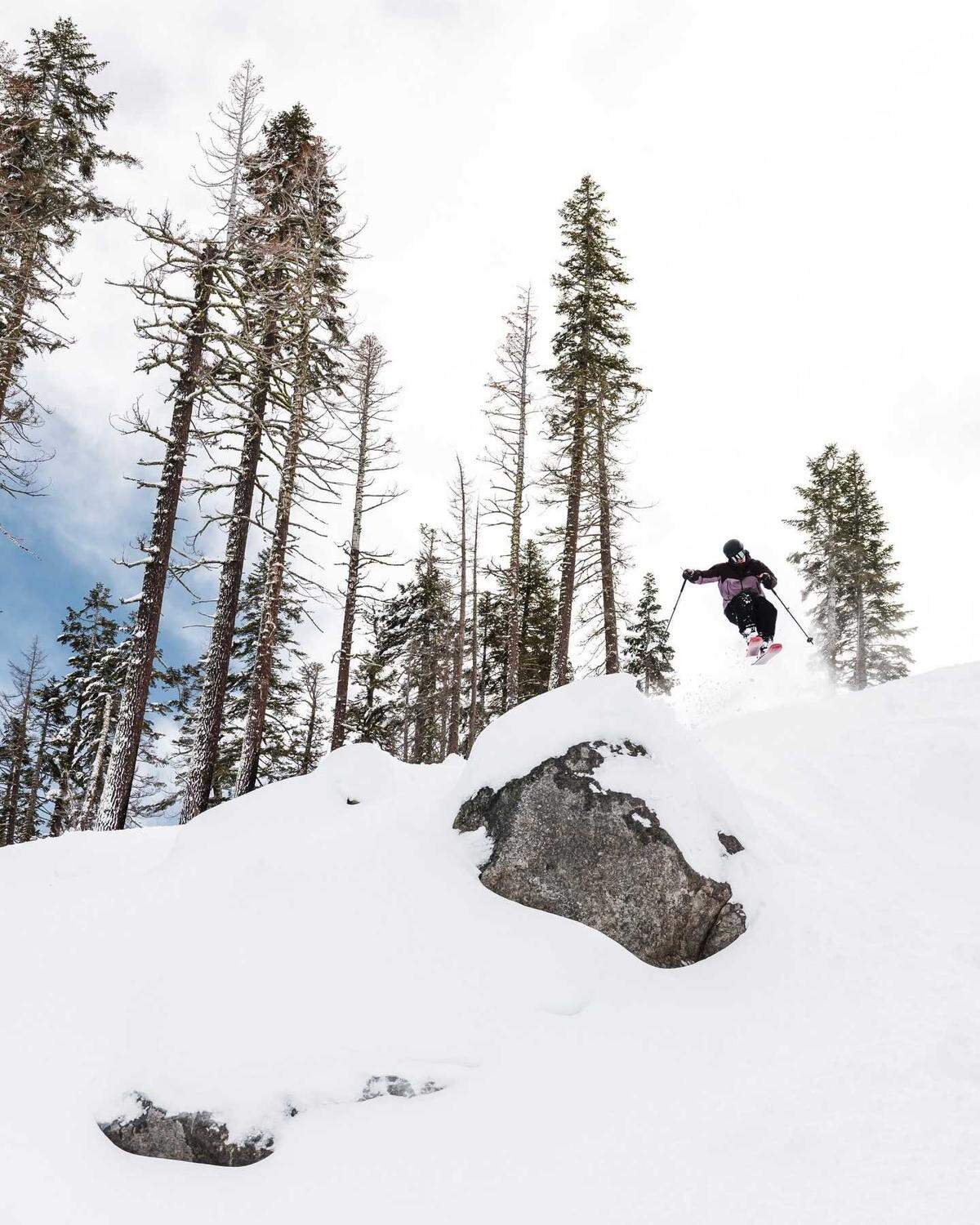 A skier descends over a crag at Sierra-at-Tahoe on Sunday, Jan. 5, 2026. Season passes for ski resorts are already on sale.