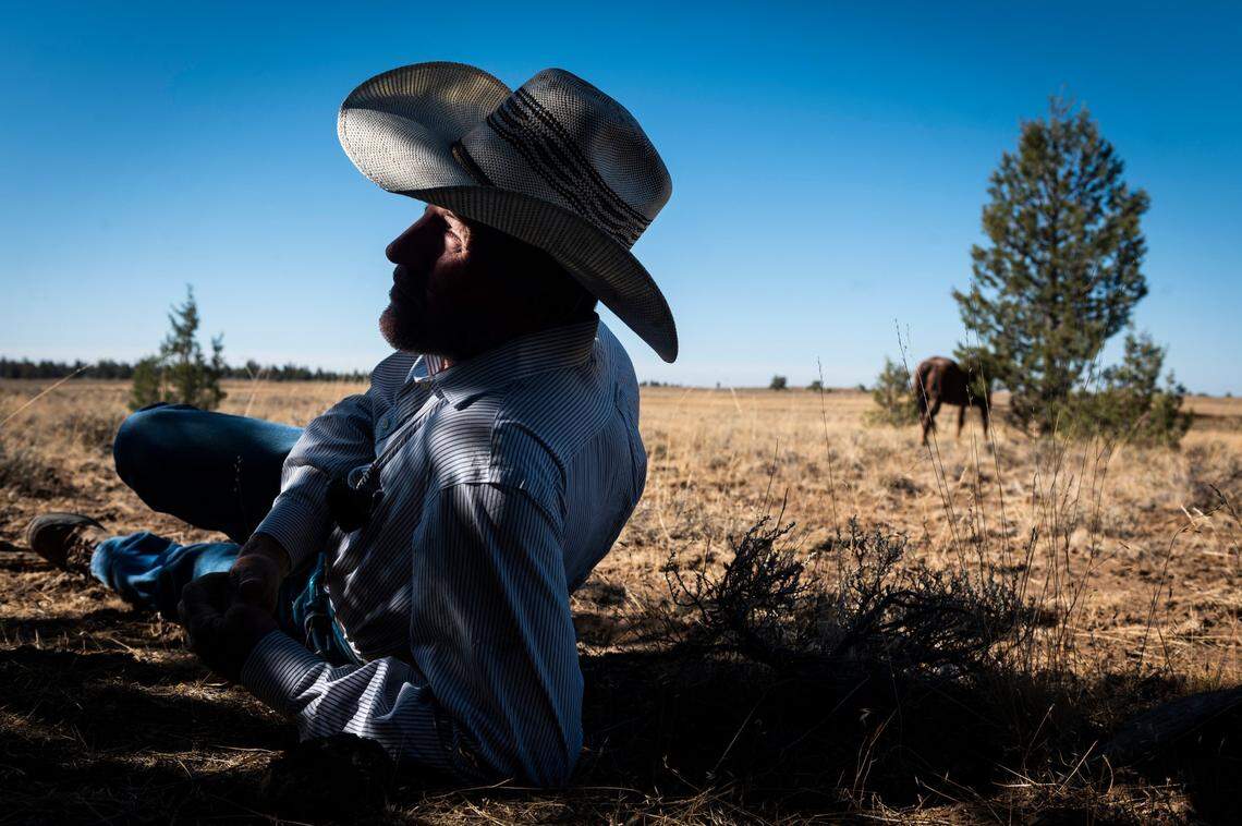 Troy Cattoor of Cattoor Livestock Roundups takes a break as he waits for his helicopter to search for wild horses in Devil’s Garden in the Modoc National Forest on Thursday, Sept. 10, 2020.
