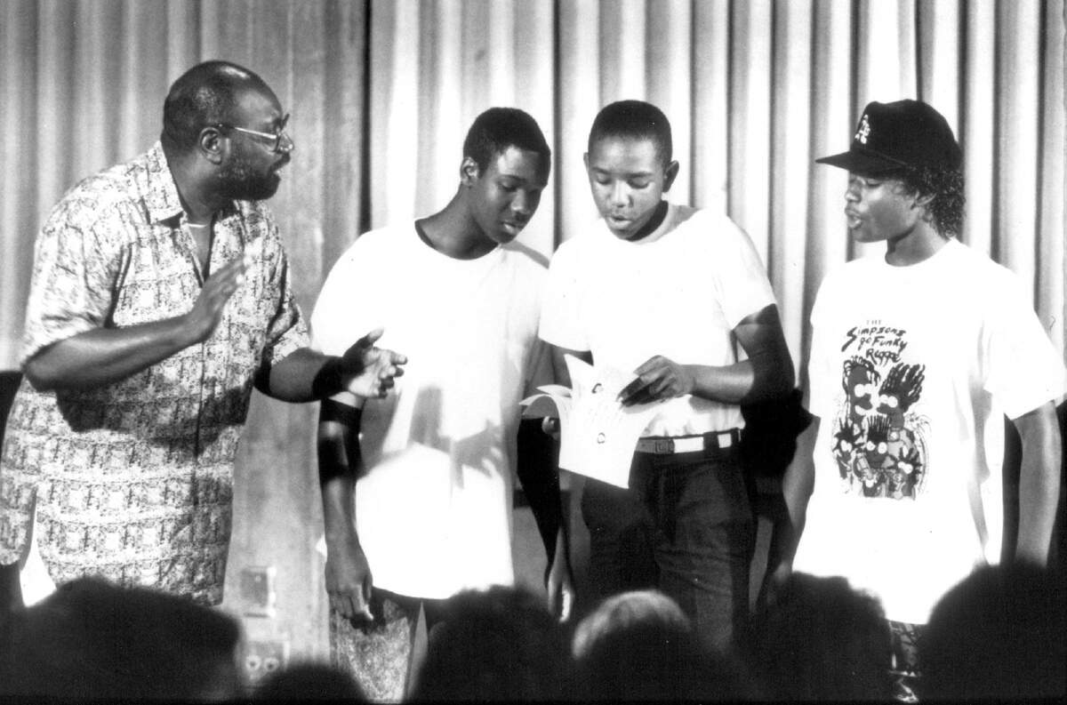McClatchy High School business teacher Frank Withrow shares a message in rap with students, from left, Larry LanChester, Emmett Richardson and Virgil Burleson in 1990. Withrow began rapping in college – before it was called rap. He worked as a teacher and administrator in the Sacramento City Unified School District and retired in 2004. 