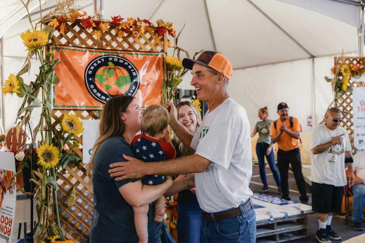 Surrounded by family, Brian Werner of Gridley celebrates his victory at the Elk Grove Giant Pumpkin Festival on Saturday, Oct. 4, 2025. Werner won with a 2,147-pound pumpkin, his biggest yet after more than two decades of growing.