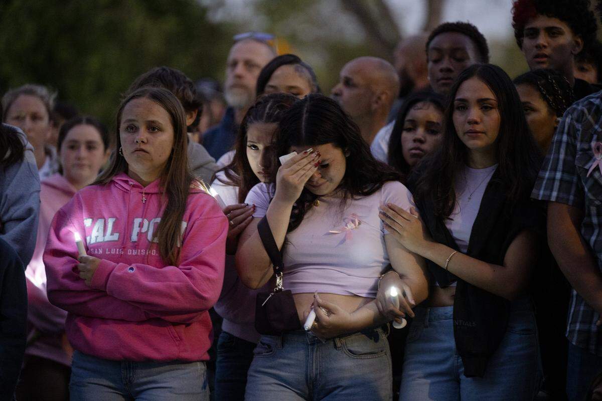 Mourners of Ariyonna Orozco, 16, and Piper Conkling, 14, who died in the fiery crash near Rancho Murieta, hold a candlelight vigil at North Laguna Creek Park  in Sacramento on Friday, May 22, 2026.
