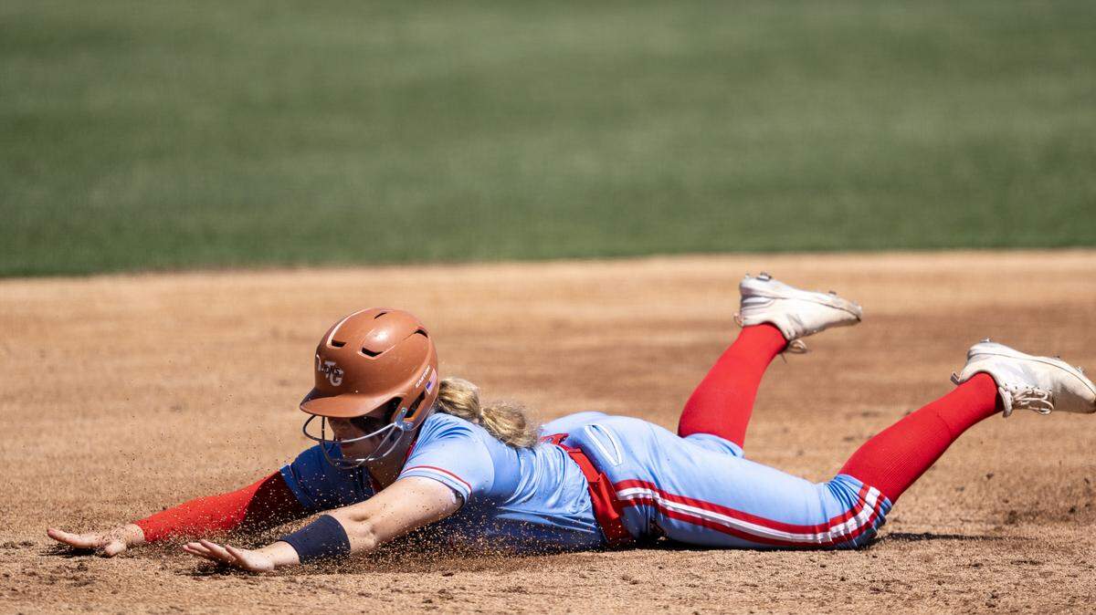 The Destiny Christian Academy Lions' Ella Dossey dives into third base after hitting a triple in the fourth inning against the Vanden Vikings on Saturday, May 23 in the CIF Sac-Joaquin Section Division III softball championship at Sacramento State. Destiny Christian defeated College Park, 13-2, on Tuesday in the opening round of the CIF Northern California championship.