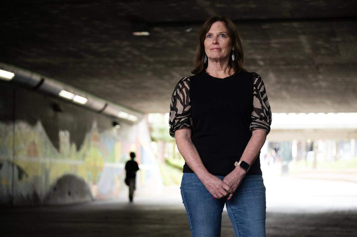 Kris Pedretti, who was attacked at knife point by the Golden State Killer in her Carmichael home in 1976 when she was 15 years old, stands for a portrait in Sacramento in 2023.