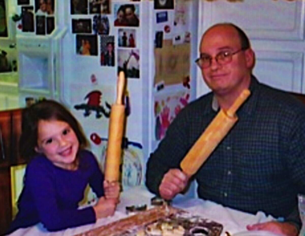 The author as a young girl and her father baking together.