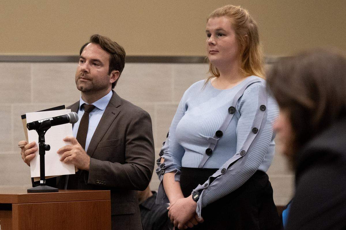 Joanna Clara Sodke, 22, with attorney Chris Walsh, is arraigned in Yolo Superior Court in Woodland on Friday, Nov. 14, 2025. She was arraigned on suspicion of felony conspiracy to commit a riot and battery in connection with an April protest at a UC Davis Turning Point USA event featuring commentator Brandon Tatum.
