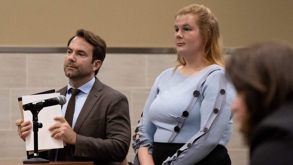 Joanna Clara Sodke, 22, with attorney Chris Walsh, is arraigned in Yolo Superior Court in Woodland on Friday. She was arraigned on suspicion of felony conspiracy to commit a riot and battery in connection with an April protest at a UC Davis Turning Point USA event featuring commentator Brandon Tatum.