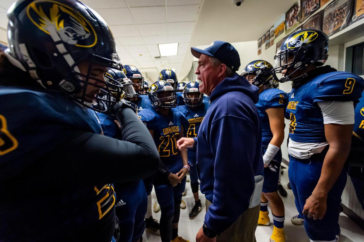 Inderkum Tigers head coach Terry Stark talks to his team before they host the Davis Blue Devils in a playoff game in 2019. 