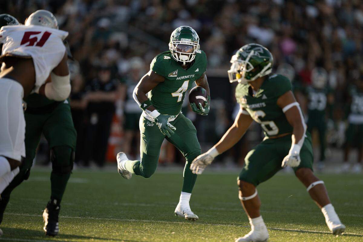 Sacramento State Hornets running back Elijah Tau-Tolliver (4) runs for a touchdown in the first quarter against the Nicholls State Colonels on Saturday at Sacramento State.