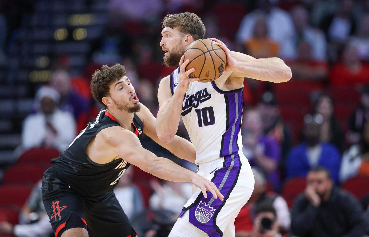 Sacramento Kings center Domantas Sabonis (10) controls the ball as Houston Rockets center Alperen Sengun (28) defends during the first quarter Saturday, Nov. 4, 2023, at Toyota Center in Houston, Texas.