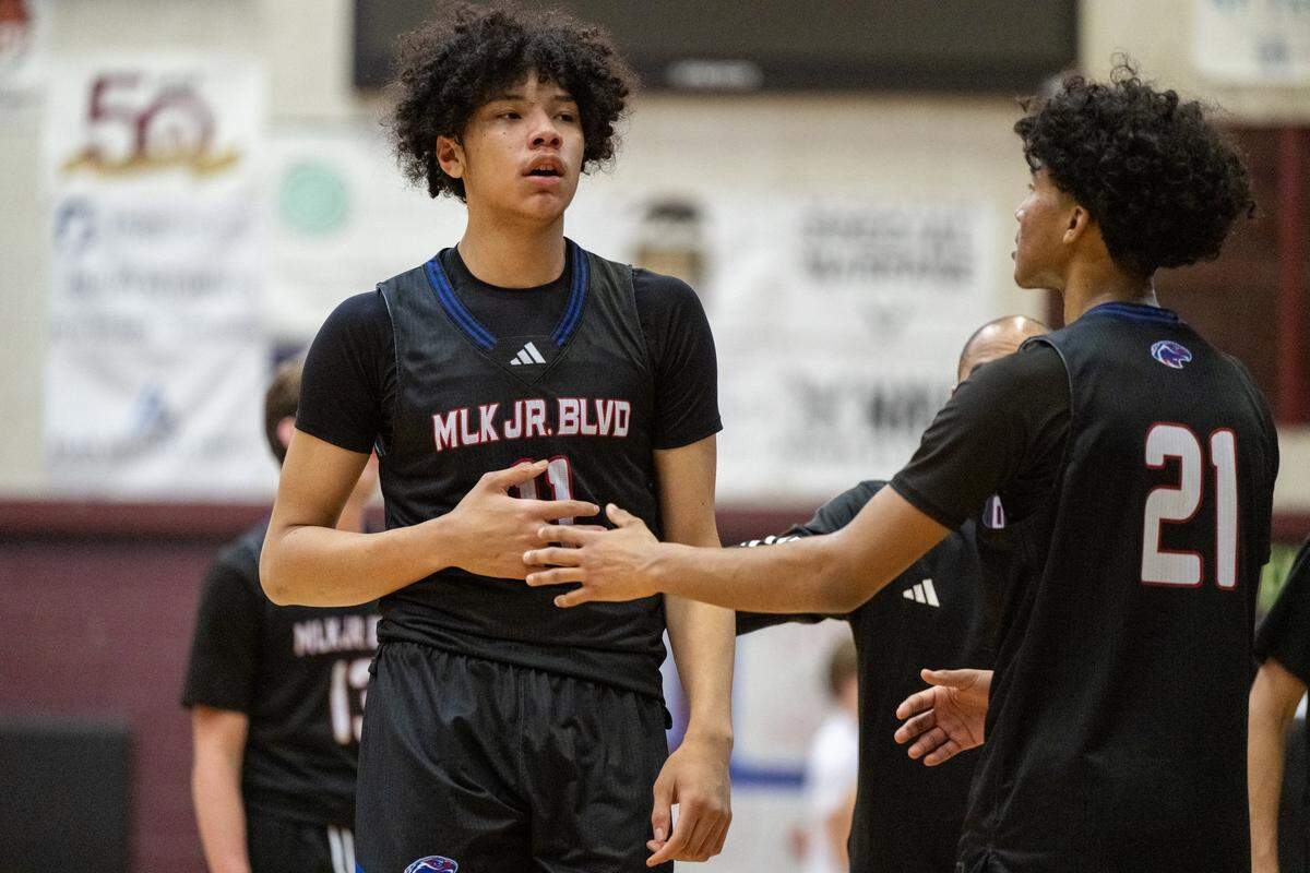 The Christian Brothers Falcons' Jaden DeJesus-Eves (11) is met by Isaac Fontaine V (21) after leaving the game in the first half against the Woodcreek Timberwolves on Jan. 8 in Roseville.