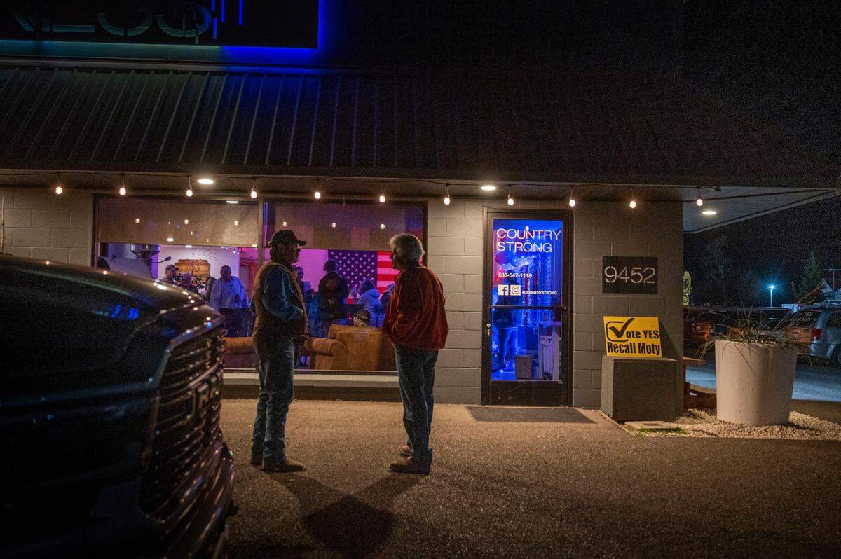 Supporters of the recall of Shasta Supervisor Leonard Moty talk Feb. 1 outside Country Strong Fitness in Palo Cedro, where an election night party was underway.