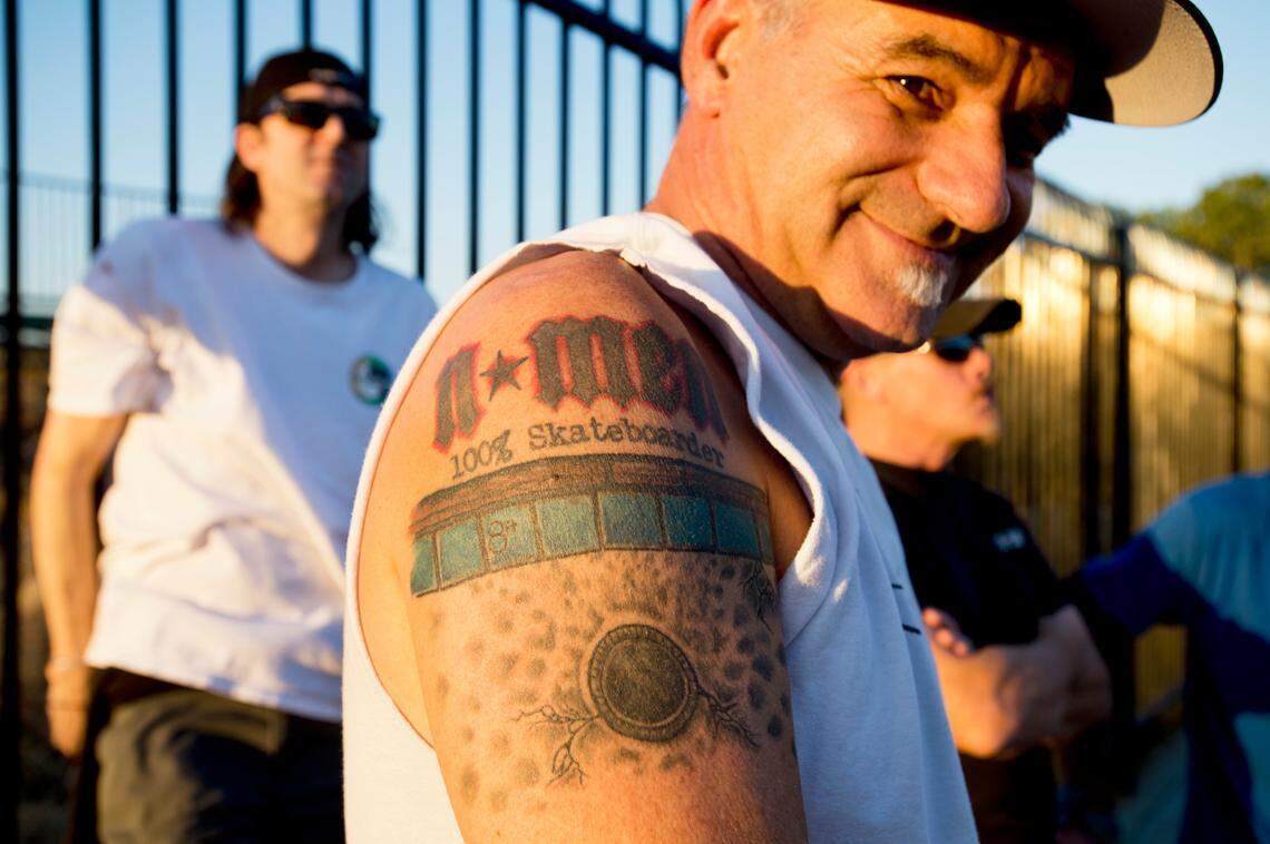 N-Men member Randy Katen shows his N-Men tattoo in 2013.