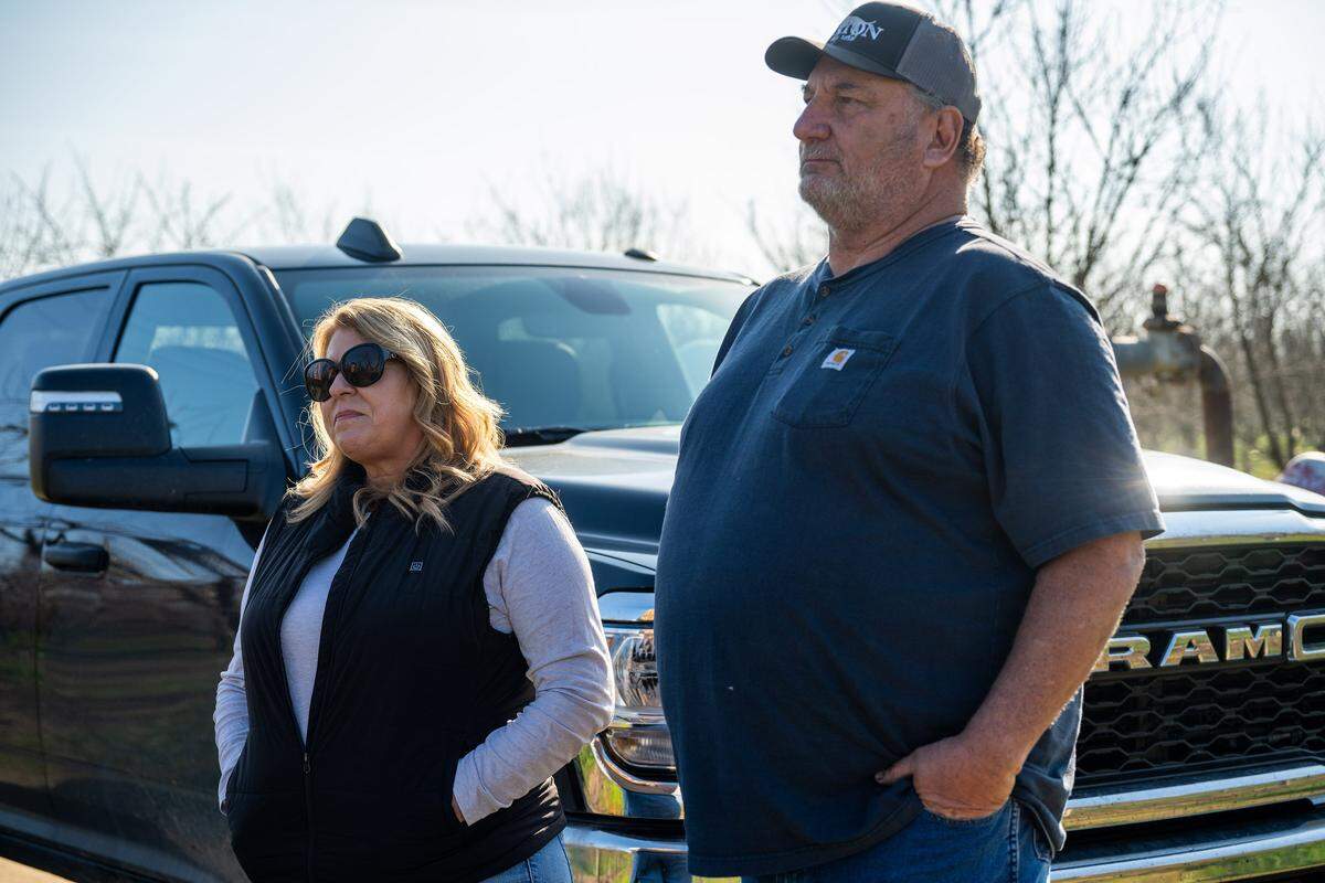 Tony and Laura McGrath, who have about 40 acres of peaches formerly contracted to Del Monte, stopped to chat with peach farmer Sarb Johl on Feb. 3. The McGraths said Pacific Coast Producers did not offer them contracts to continue producing that acreage.