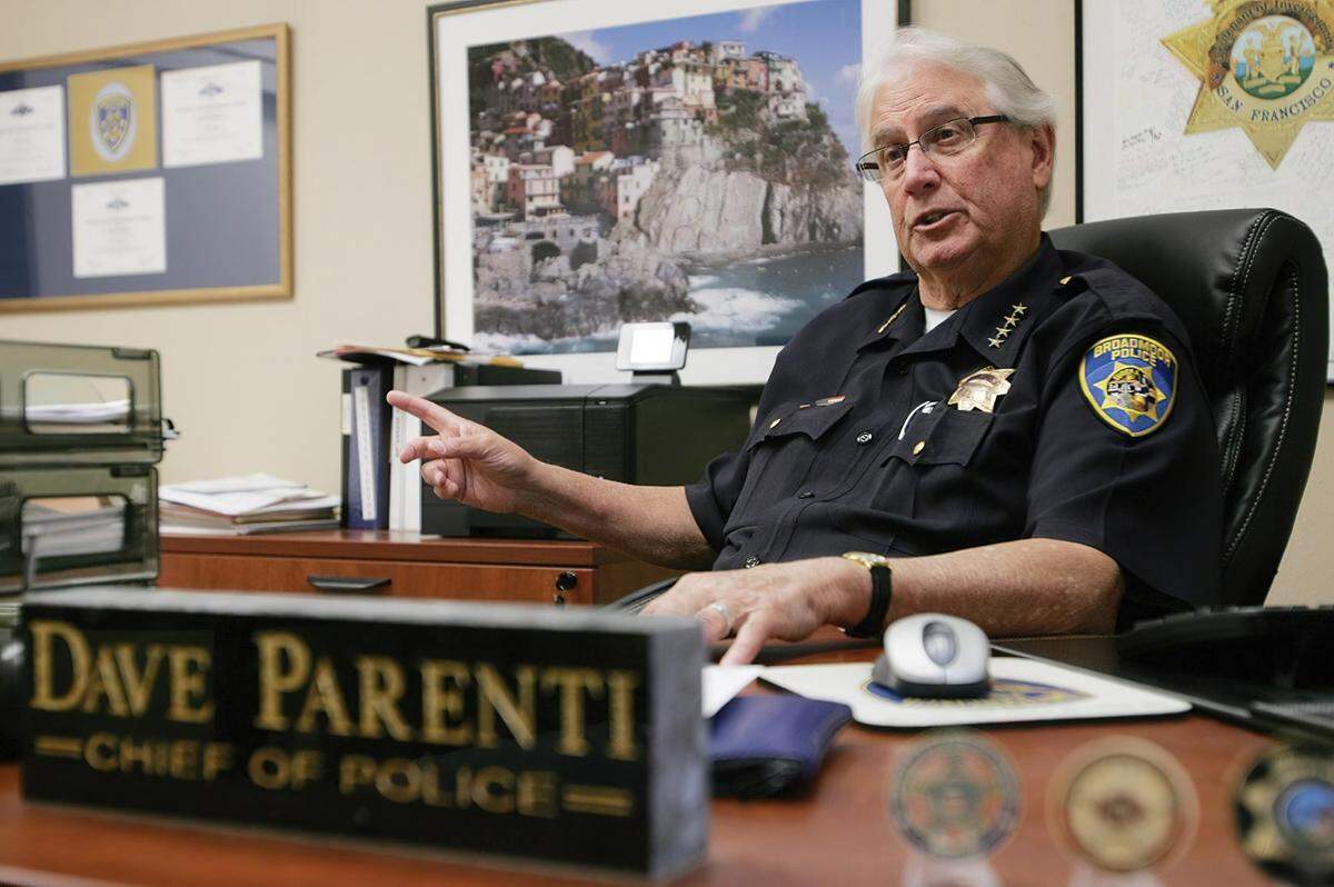 Broadmoor Police Chief Dave Parenti sits at his desk in 2013. The CalPERS audit found that Parenti improperly increased his yearly pension retirement from $93,000 a year to $152,292.