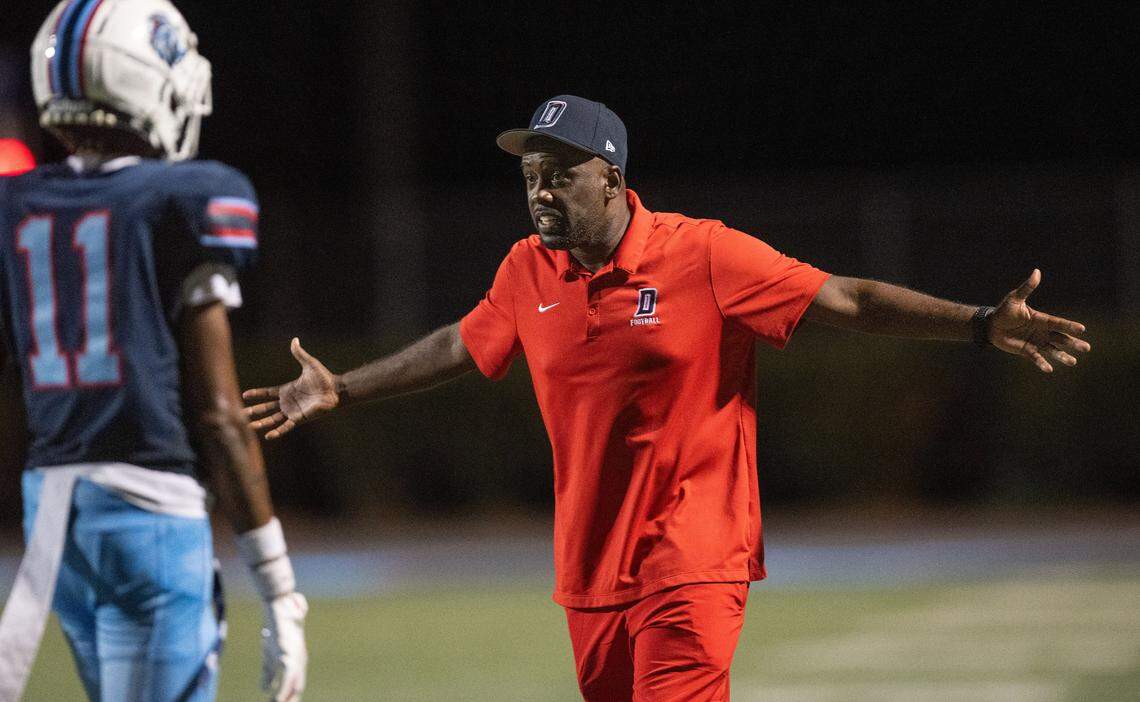 Antuan Simmons, Destiny Christian assistant head coach and defensive coordinator, rallies his team during a timeout on Friday.