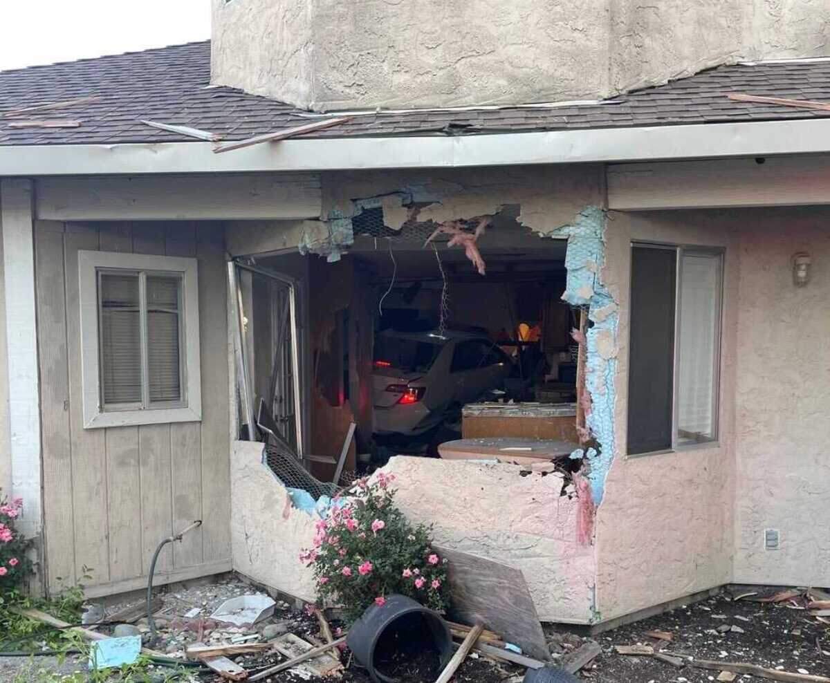 The scene after a Toyota Camry crashed into a house on the 8200 block of Spengler Road in south Sacramento after a short pursuit with sheriff’s deputies Sunday, June 4, 2023.