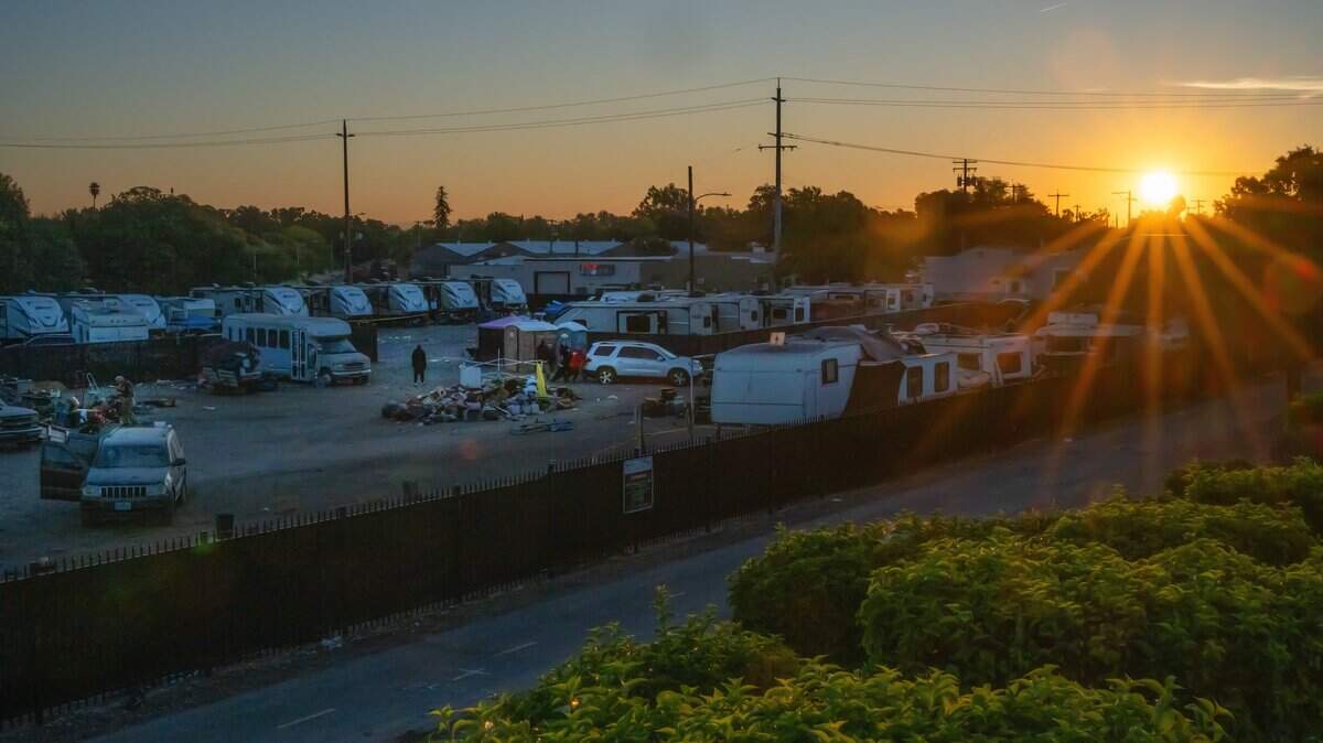 As the sun rose at Camp Resolution on Monday, Aug. 26, 2024, its longtime residents scrambled to gather their belongings before the city of Sacramento crews arrived to remove the homeless encampment. California’s Legislature and Gov. Gavin Newsom are negotiating how much to put into a state homelessness program in the upcoming fiscal year.