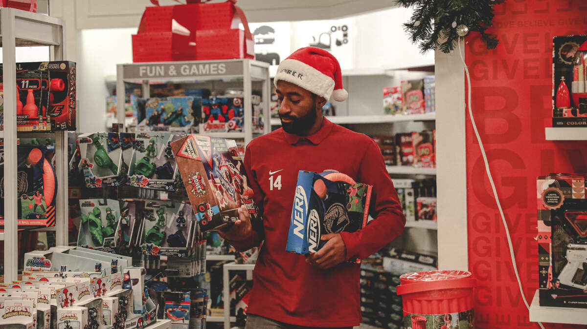 Sacramento Republic player Duke Lacroix examines his options during a shopping spree at Macy’s on Wednesday, Dec. 8, 2021 to benefit the soccer team’s charity program.