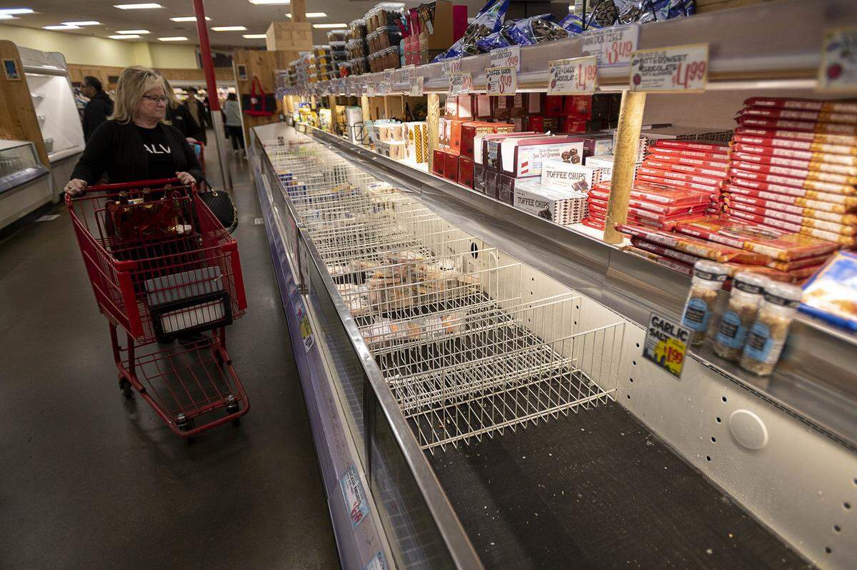 The frozen food isle at the Trader Joe’s on Marconi and Fulton avenues is nearly empty on Monday afternoon, March 16, 2020 in Sacramento.