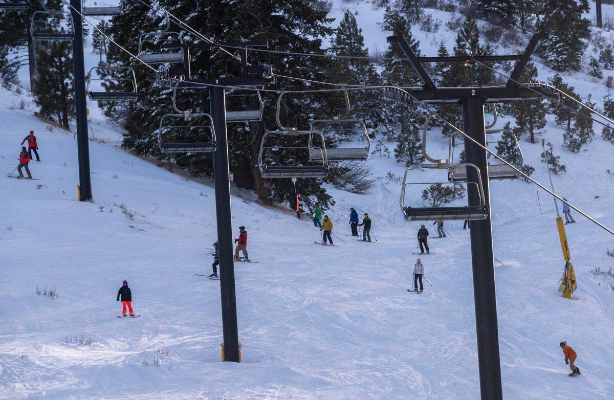 Skiers and snowboarders go down the run at Palisades Tahoe on Thursday, Jan. 11, 2024, a day after a deadly avalanche buried multiple people and killed a 66-year-old man.