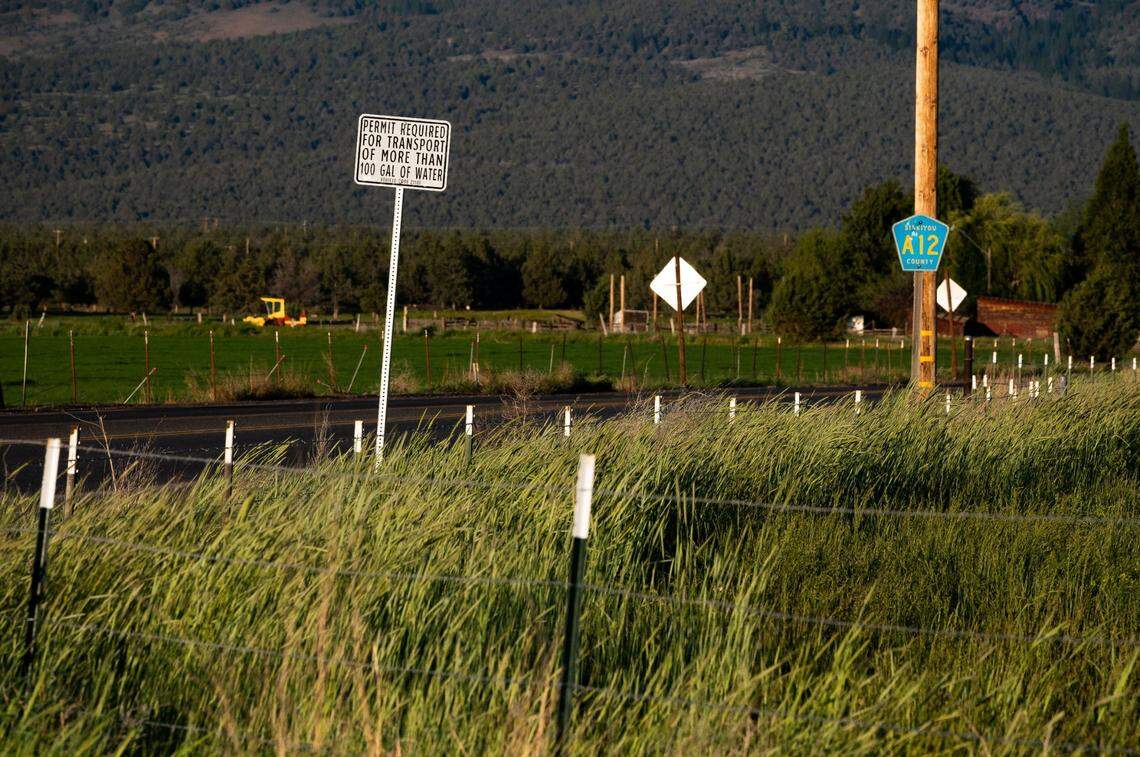 “Permit required for transport of more than 100 gal of water” reads a sign announcing the Siskiyou County ordinance, designed to halt illegal marijuana grows, along County Road A-12.