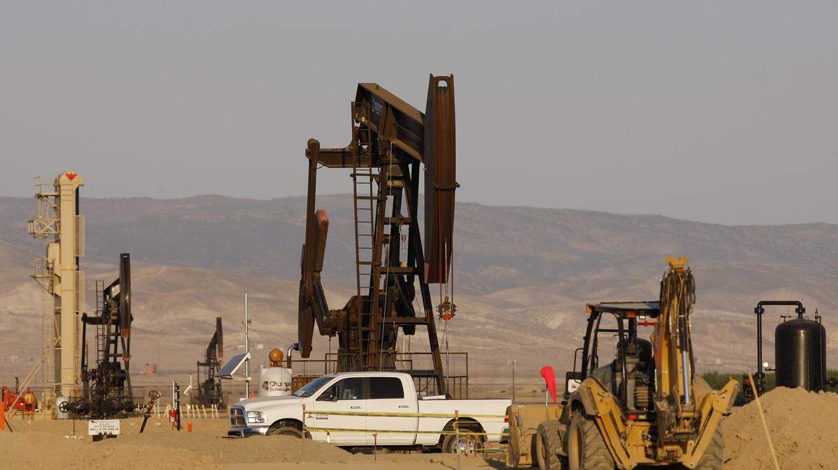 Pump jacks stand in a field being developed for drilling using fracking near Lost Hills in 2014.
