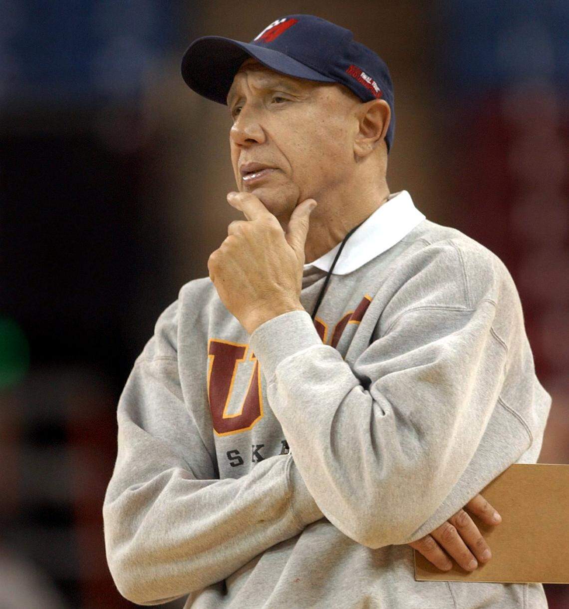 Mike Bibby’s father Henry Bibby, then-head coach of the USC Trojans, watches his team practice at Arco Arena in Sacramento in 2002. 