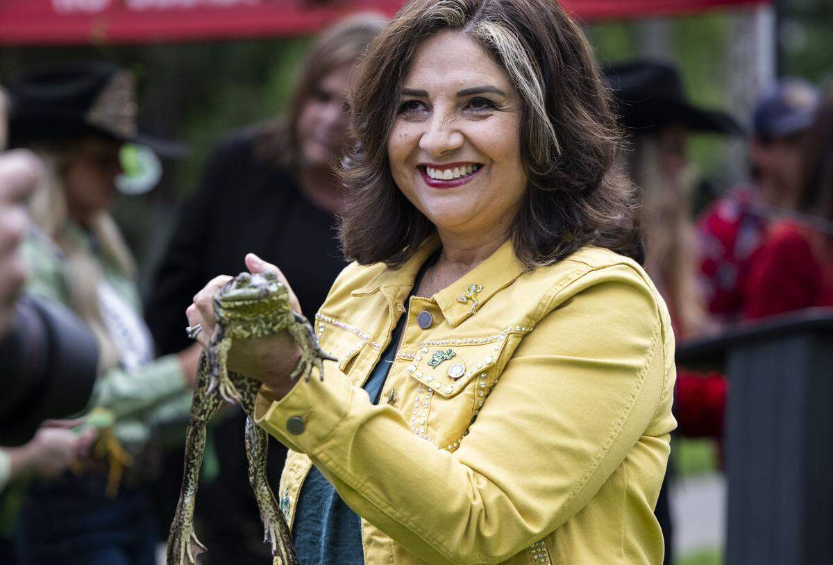 State Sen. Marie Alvarado-Gil, R-Jackson, holds a frog during the 50th annual Capitol frog jump in Sacramento on Tuesday.