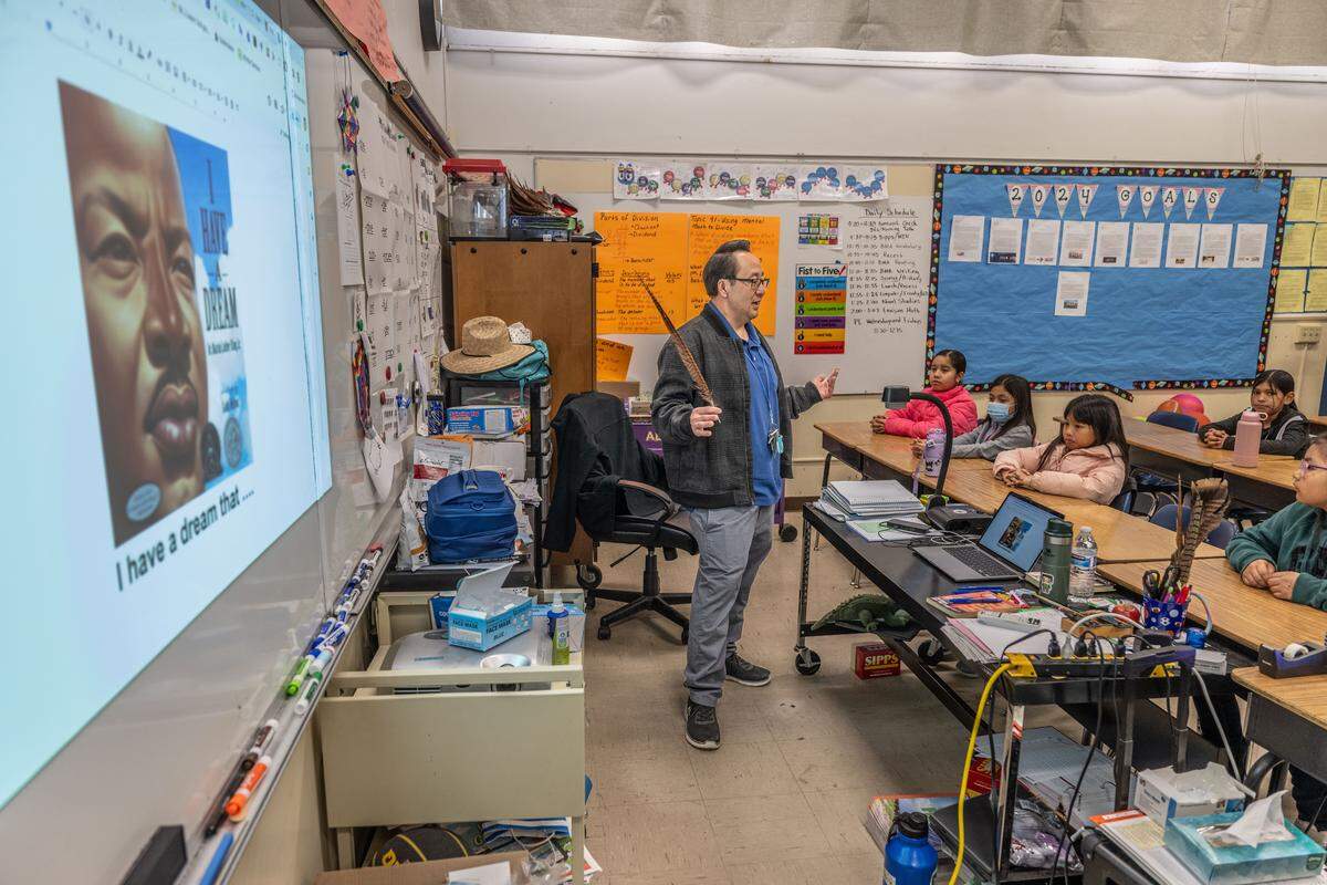 Ethel I. Baker Elementary fourth grade teacher Souchoy Saechou talks to his students at the start of class as part of the school’s integrated Center of Wellness program on Thursday, Jan. 18, 2024.