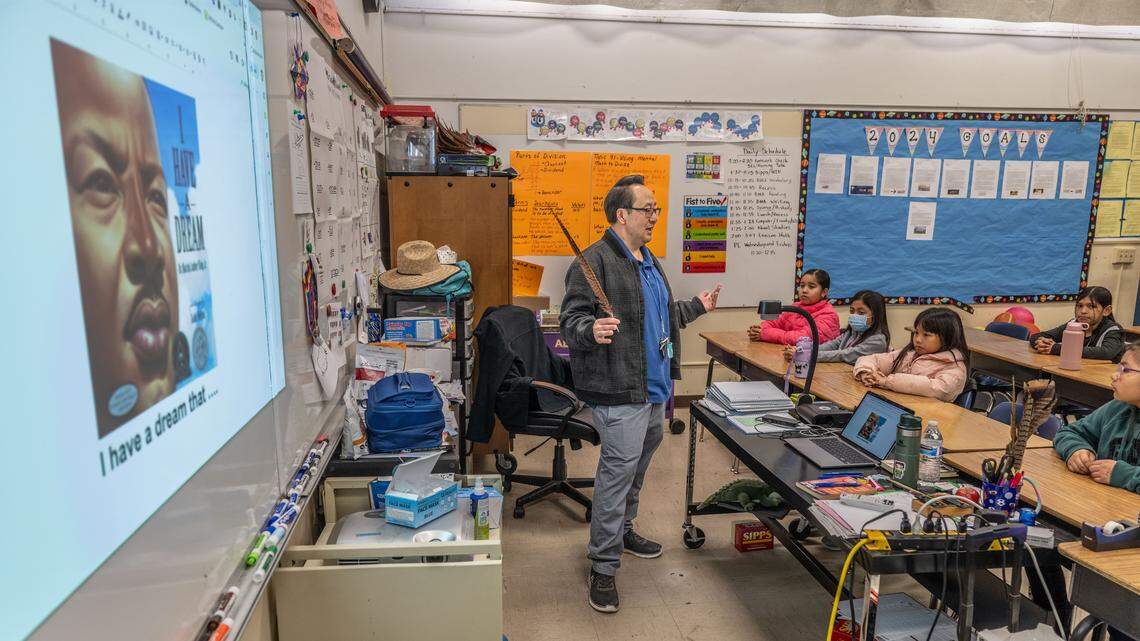 Ethel I. Baker Elementary fourth grade teacher Souchoy Saechou talks to his students at the start of class as part of the school’s integrated Center of Wellness program on Thursday, Jan. 18, 2024. The program is designed to help the mental health of students and their families by using a different approach to discipline and teaching.
