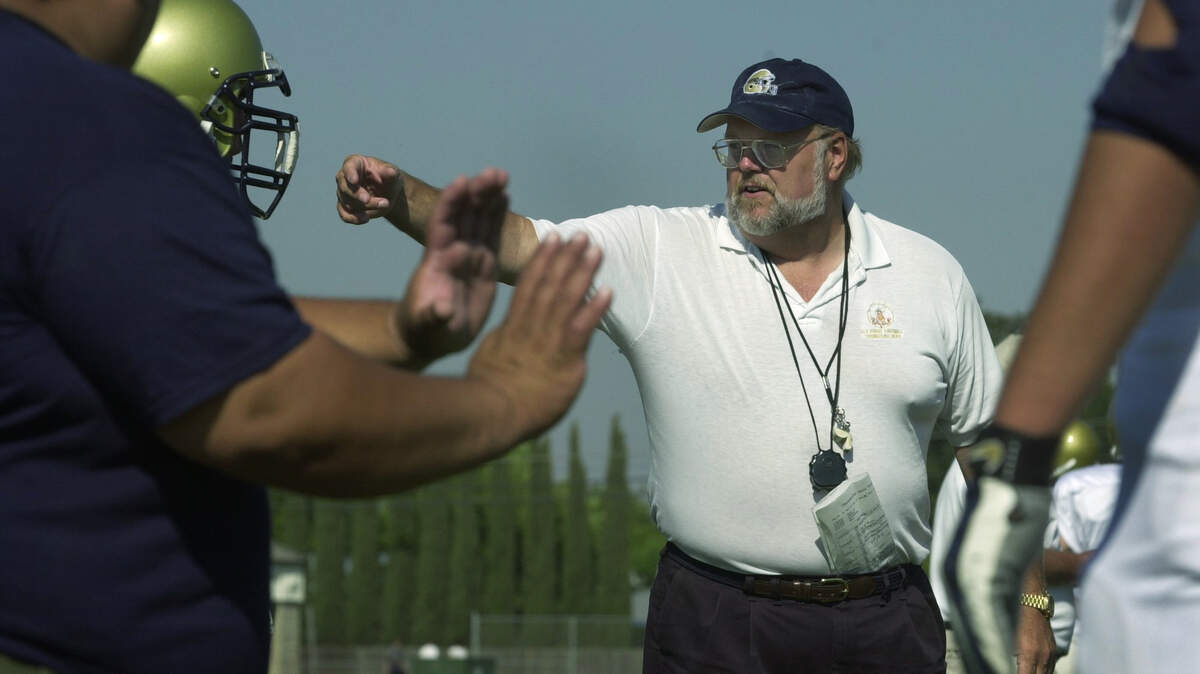 Coach Bob Lee directs his team during practice in 2002 as the head football coach at Elk Grove High School, his only season in that position.