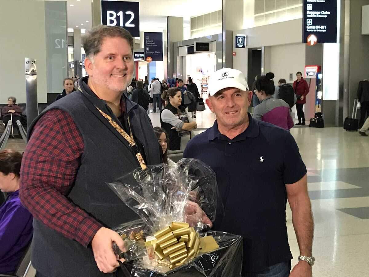Mark Haneke, air service development manager for Sacramento International Airport (left) poses with the airportâs 12 millionth flier of 2018, Gary Smith. Smith was given free Southwest rewards points and free parking, as well as a gift basket of local goodies.