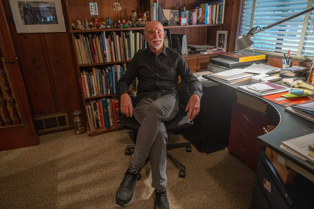 Peter Saucerman sits in chair earlier this month in the same room that Leonard F. Starks, the noted Sacramento architect who designed and lived in Saucerman’s home, sits in Sacramento Bee file photograph from 1978.